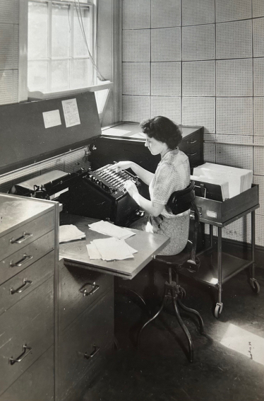 My Nan working at her desk at Chatham Dockyard 